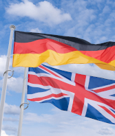 Uk,And,German,Flags,Flutter,In,The,Wind. SOCMA Show February 19-21 in Nashville, Tennessee, US